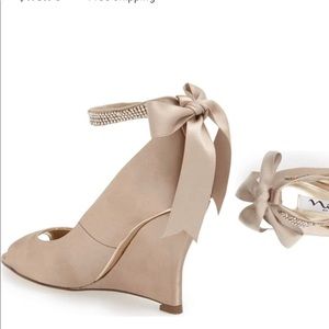 Nina “Emma” embellished ankle strap wedge heels.
